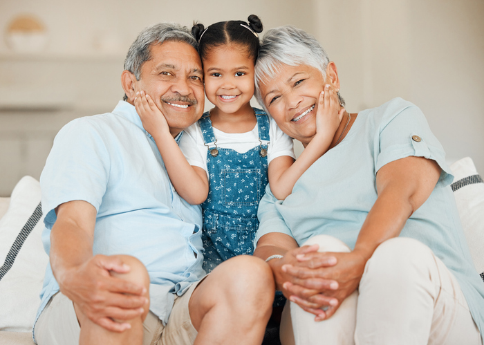 Senior man and senior woman with their grandchild