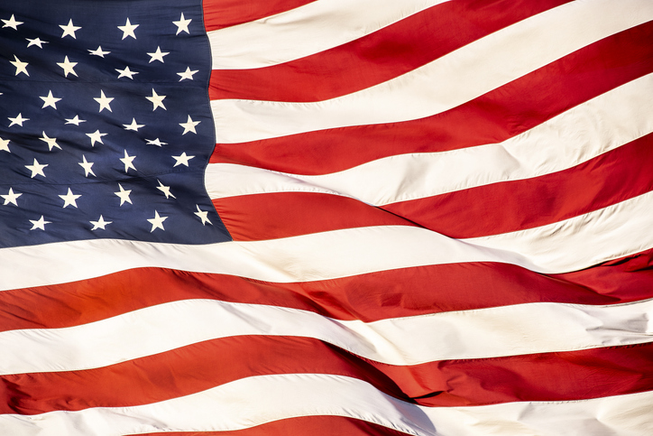 American flag rippling, moving, waving in the wind.